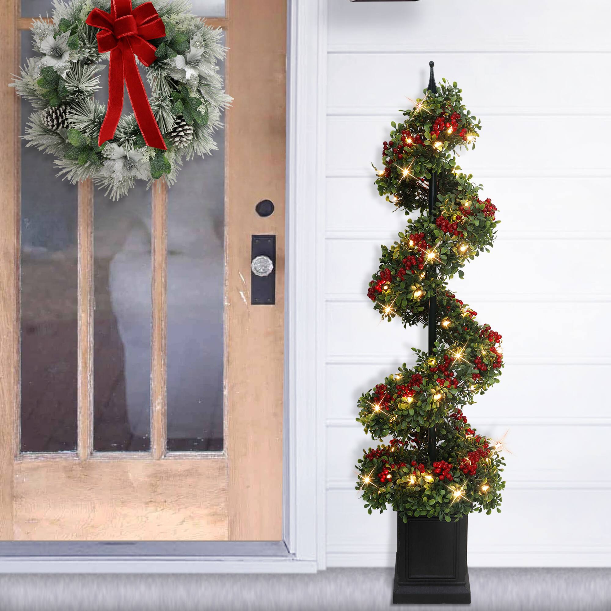 4ft. Pre-Lit Artificial Potted Swirl Tree Adorned with Red Berries, Warm White LED Lights